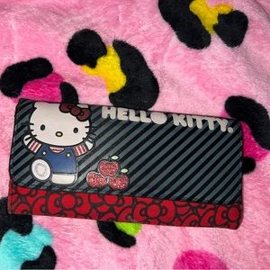 hello kitty loungefly wallet! used/has some flaws but still very cute/sturdy!